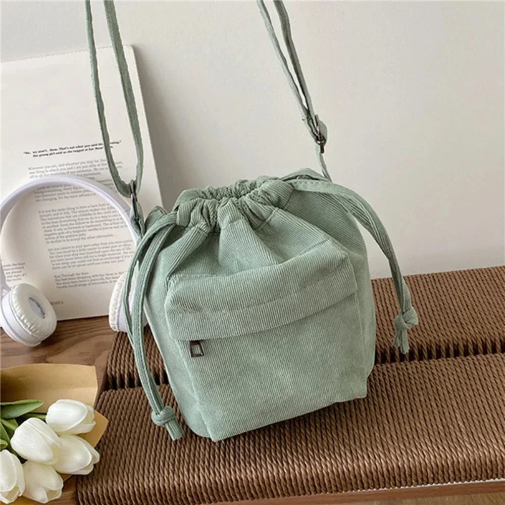 Carry your essentials in style with this cute middle shoulder drawstring bucket bag—a versatile and fashionable accessory for women on the go! -
