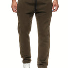 Stay comfy and warm in these men's solid color fleece-lined joggers! -