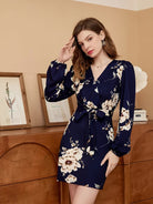 Rock an elegant look in this V-neck belted dress with a stylish floral print! -