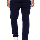 Stay comfy and warm in these men's solid color fleece-lined joggers! -
