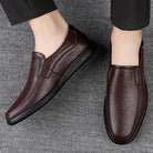 Step into comfort and safety with these men's genuine leather slip-on, slip-resistant shoes! -