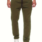 Stay comfy and warm in these men's solid color fleece-lined joggers! -