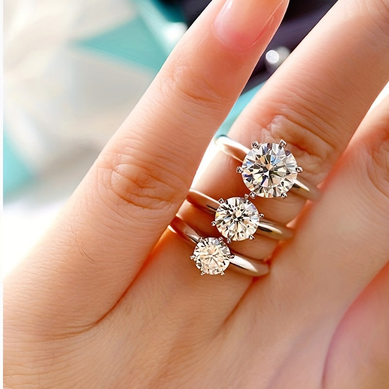 Sparkle bright with this women's one-carat silver moissanite ring! -