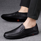 Step into comfort and safety with these men's genuine leather slip-on, slip-resistant shoes! -