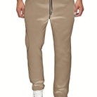Stay comfy and warm in these men's solid color fleece-lined joggers! -