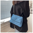 Elevate your style with this fashion luxury denim blue shoulder bag for women. Designed as a briefcase, this handbag is a chic and stylish accessory for a sophisticated and classy look. -
