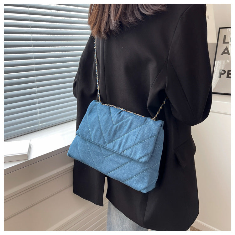 Elevate your style with this fashion luxury denim blue shoulder bag for women. Designed as a briefcase, this handbag is a chic and stylish accessory for a sophisticated and classy look. -