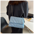 Elevate your style with this fashion luxury denim blue shoulder bag for women. Designed as a briefcase, this handbag is a chic and stylish accessory for a sophisticated and classy look. -