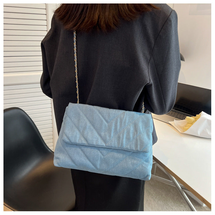 Elevate your style with this fashion luxury denim blue shoulder bag for women. Designed as a briefcase, this handbag is a chic and stylish accessory for a sophisticated and classy look. -
