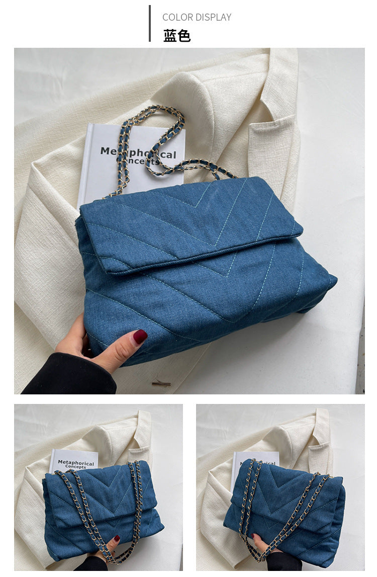 Elevate your style with this fashion luxury denim blue shoulder bag for women. Designed as a briefcase, this handbag is a chic and stylish accessory for a sophisticated and classy look. -