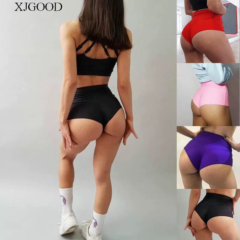 Elevate your workout wardrobe with these solid color high-waisted yoga shorts, designed for a flattering fit and maximum comfort during exercise sessions! -