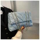Elevate your style with this fashion luxury denim blue shoulder bag for women. Designed as a briefcase, this handbag is a chic and stylish accessory for a sophisticated and classy look. -