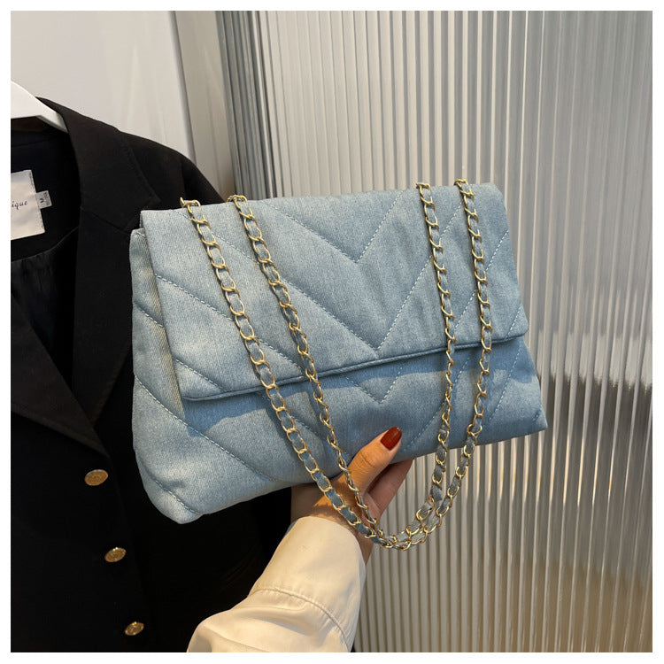 Elevate your style with this fashion luxury denim blue shoulder bag for women. Designed as a briefcase, this handbag is a chic and stylish accessory for a sophisticated and classy look. -