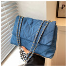 Elevate your style with this fashion luxury denim blue shoulder bag for women. Designed as a briefcase, this handbag is a chic and stylish accessory for a sophisticated and classy look. -