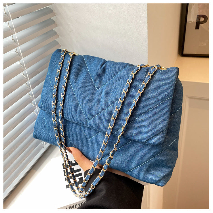 Elevate your style with this fashion luxury denim blue shoulder bag for women. Designed as a briefcase, this handbag is a chic and stylish accessory for a sophisticated and classy look. -