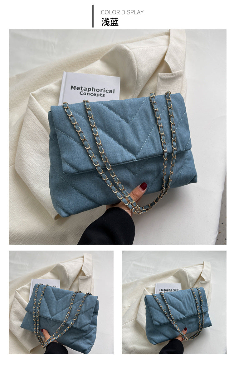 Elevate your style with this fashion luxury denim blue shoulder bag for women. Designed as a briefcase, this handbag is a chic and stylish accessory for a sophisticated and classy look. -