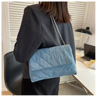 Elevate your style with this fashion luxury denim blue shoulder bag for women. Designed as a briefcase, this handbag is a chic and stylish accessory for a sophisticated and classy look. -