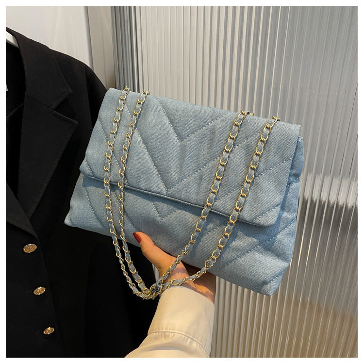 Elevate your style with this fashion luxury denim blue shoulder bag for women. Designed as a briefcase, this handbag is a chic and stylish accessory for a sophisticated and classy look. -