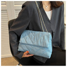 Elevate your style with this fashion luxury denim blue shoulder bag for women. Designed as a briefcase, this handbag is a chic and stylish accessory for a sophisticated and classy look. -