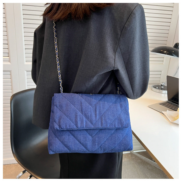 Elevate your style with this fashion luxury denim blue shoulder bag for women. Designed as a briefcase, this handbag is a chic and stylish accessory for a sophisticated and classy look. -