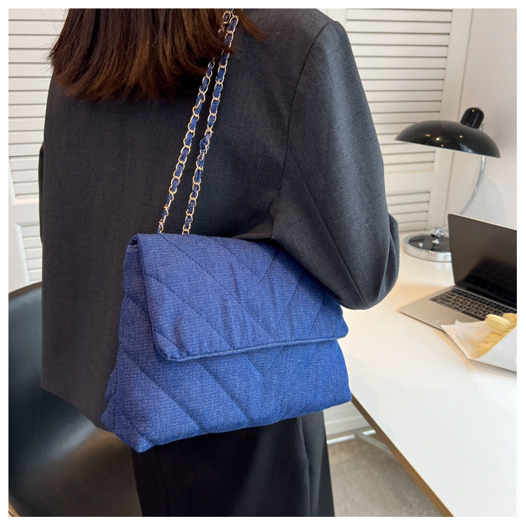 Elevate your style with this fashion luxury denim blue shoulder bag for women. Designed as a briefcase, this handbag is a chic and stylish accessory for a sophisticated and classy look. -