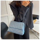Elevate your style with this fashion luxury denim blue shoulder bag for women. Designed as a briefcase, this handbag is a chic and stylish accessory for a sophisticated and classy look. -
