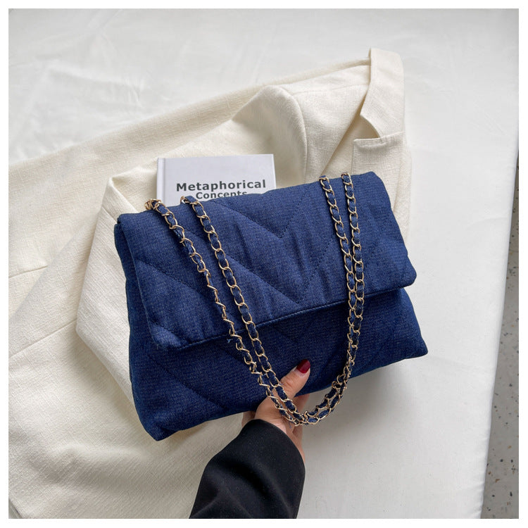 Elevate your style with this fashion luxury denim blue shoulder bag for women. Designed as a briefcase, this handbag is a chic and stylish accessory for a sophisticated and classy look. -