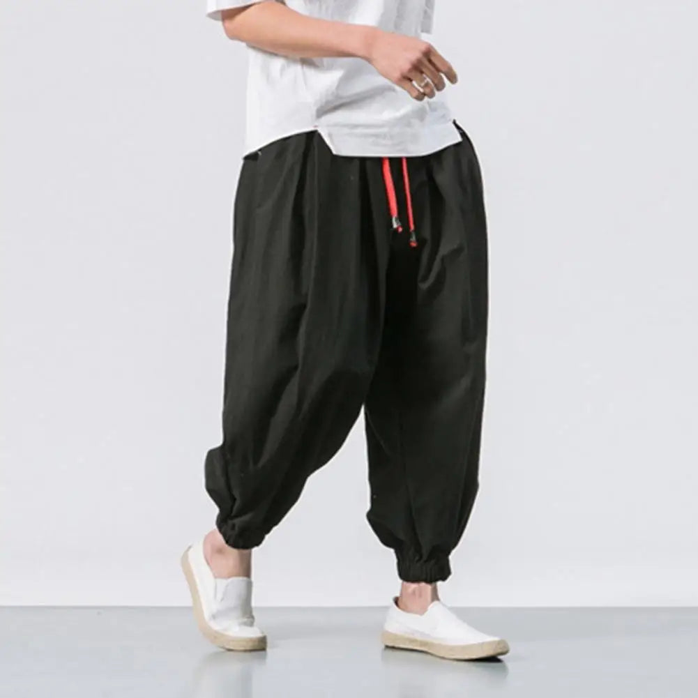 Stay comfortable and stylish in these men's baggy jogging pants featuring a drawstring waist—an ideal choice for a relaxed and casual look! -