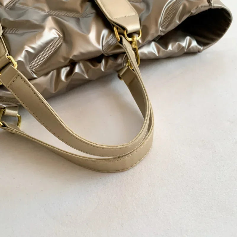 Stay on-trend with this fashion-forward large tote padded handbag featuring a designer quilted design. This stylish accessory is perfect for adding a touch of sophistication and elegance to your ensemble. -