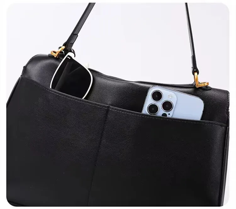 Elevate your style with this genuine leather women's tote bag. Featuring a distinctive gold buckle, this elegant handbag is perfect for commuting and adding a touch of sophistication to your look. -