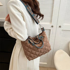 Elevate your style with these luxury designer shoulder crossbody bags for women. Featuring a quilted padded design from a top designer brand, these handbags are perfect for adding a touch of elegance to any outfit. -