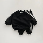 Keep your little one stylish and comfy with this cool two-piece baby suit—featuring a letter-printed zip-up top and matching leisure sports pants! -