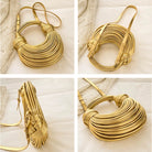 Make a statement with this gold luxury designer brand handwoven noodle bag. With a rope-knotted hobo design and a chic silver evening clutch, this bag is the epitome of high fashion and sophistication. -