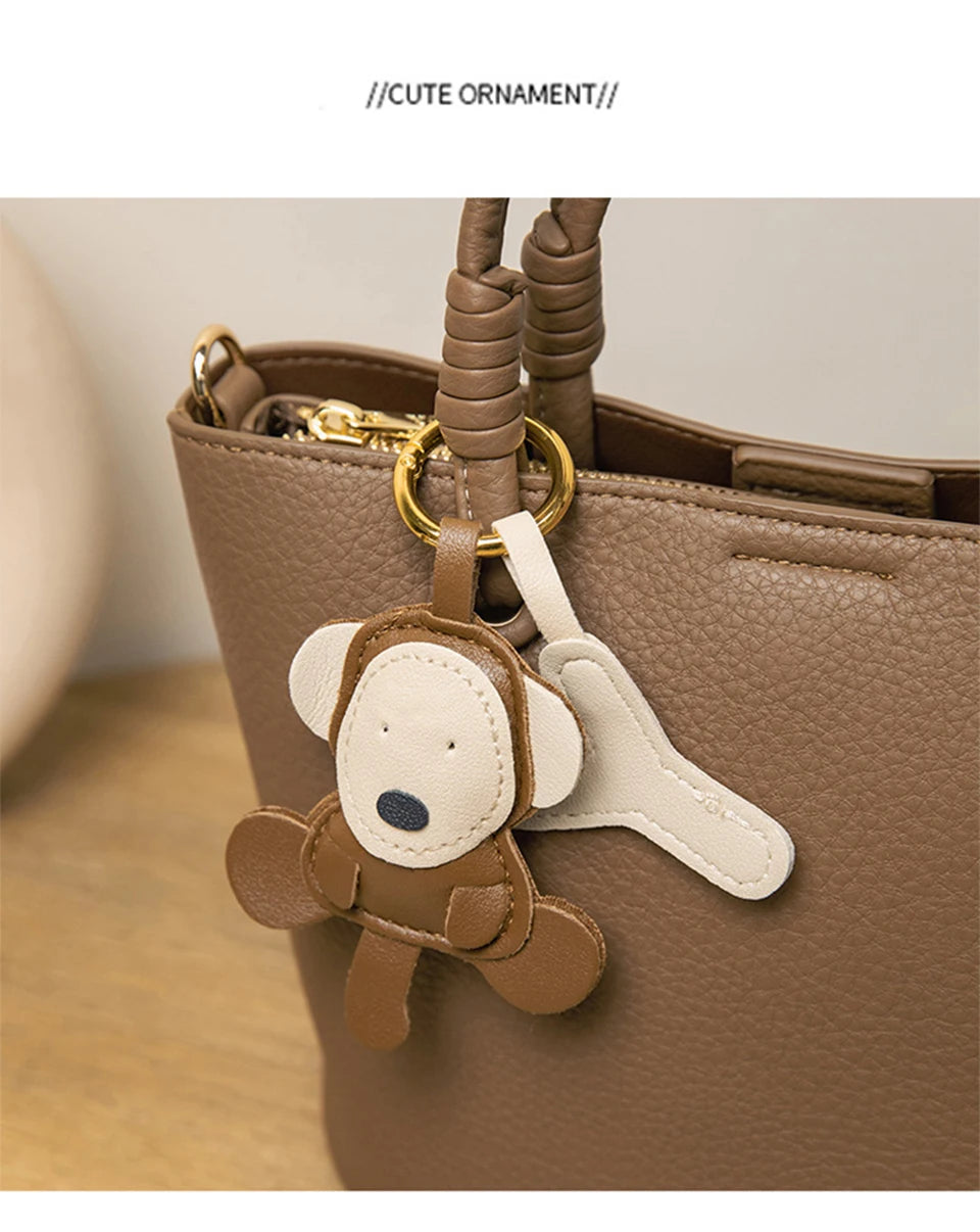 Upgrade your accessories with this new bucket bag for women. Featuring a fashionable and versatile design, this handheld bag is perfect for adding a chic and trendy touch to your look. -