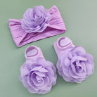Complete your baby girl's outfit with this sweet 2-piece set—featuring delicate pearl, lace, and flower headbands along with matching socks! -
