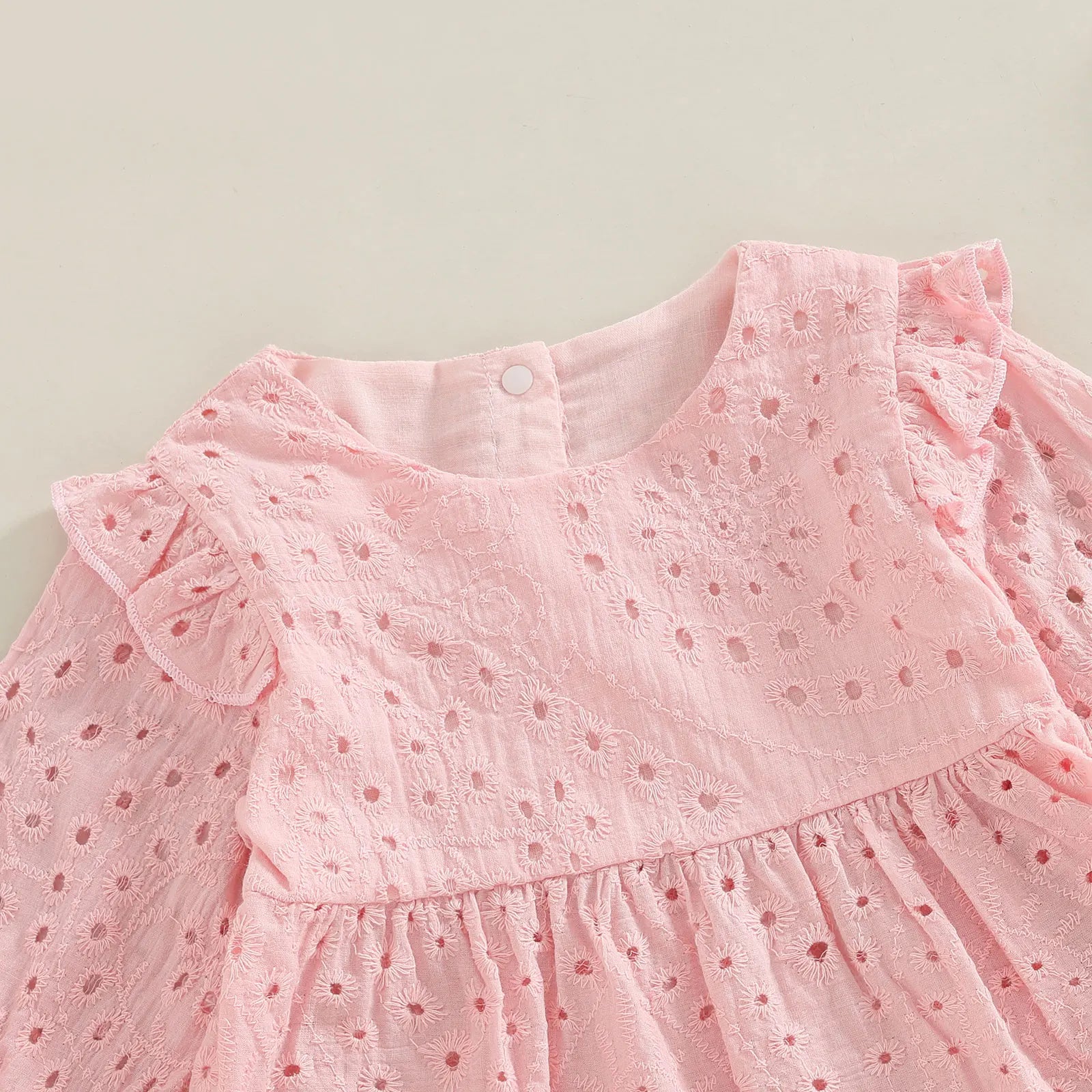 Keep your toddler cozy and cute in this 2-piece set featuring a solid color cutout round neck long sleeve top and matching bottoms—perfect for baby girls 3-24m! -