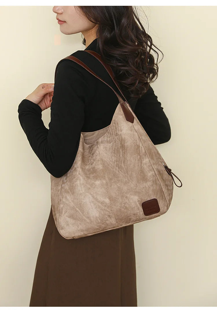 Stay organized and stylish with this large work tote bag for women. Designed with designer PU leather, this big bucket bag is perfect for carrying all your essentials in a chic and fashionable way. -