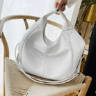 Make a stylish statement with these large shoulder bags designed for women. Crafted from soft leather, these fashionable handbags are perfect for adding a touch of sophistication to any outfit. -
