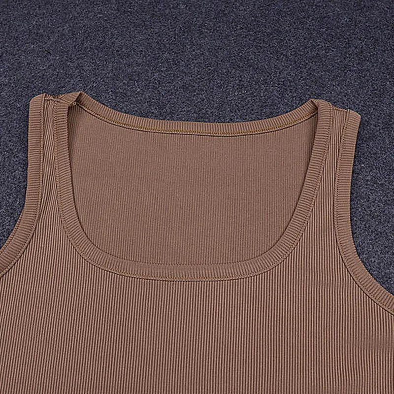 Achieve a hot and sexy look with this sleeveless knit bodysuit featuring an off-shoulder halter design. Perfect for making a stylish and alluring statement! -