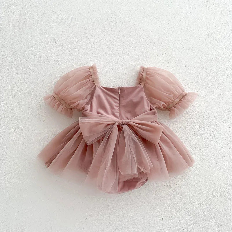Dress your toddler in sweet style with this new baby lace dress featuring a big bowknot and short sleeves—perfect for special occasions! -