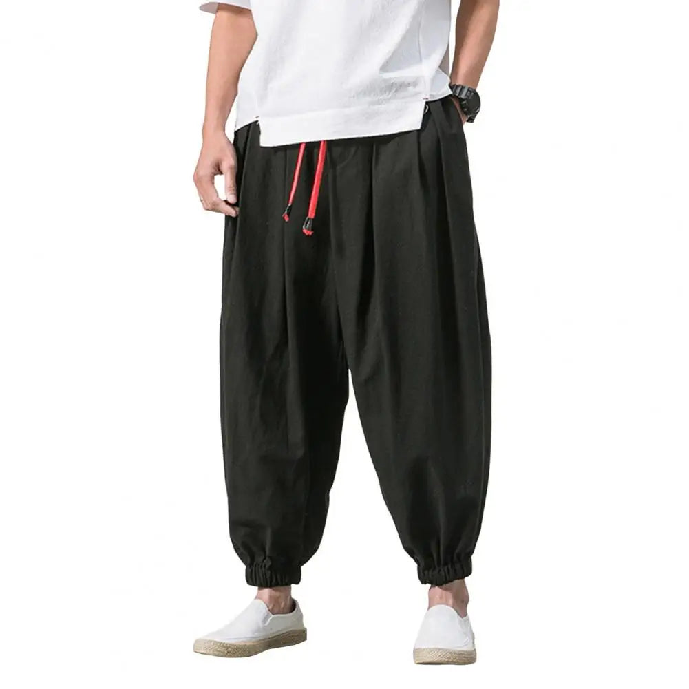 Stay comfortable and stylish in these men's baggy jogging pants featuring a drawstring waist—an ideal choice for a relaxed and casual look! -