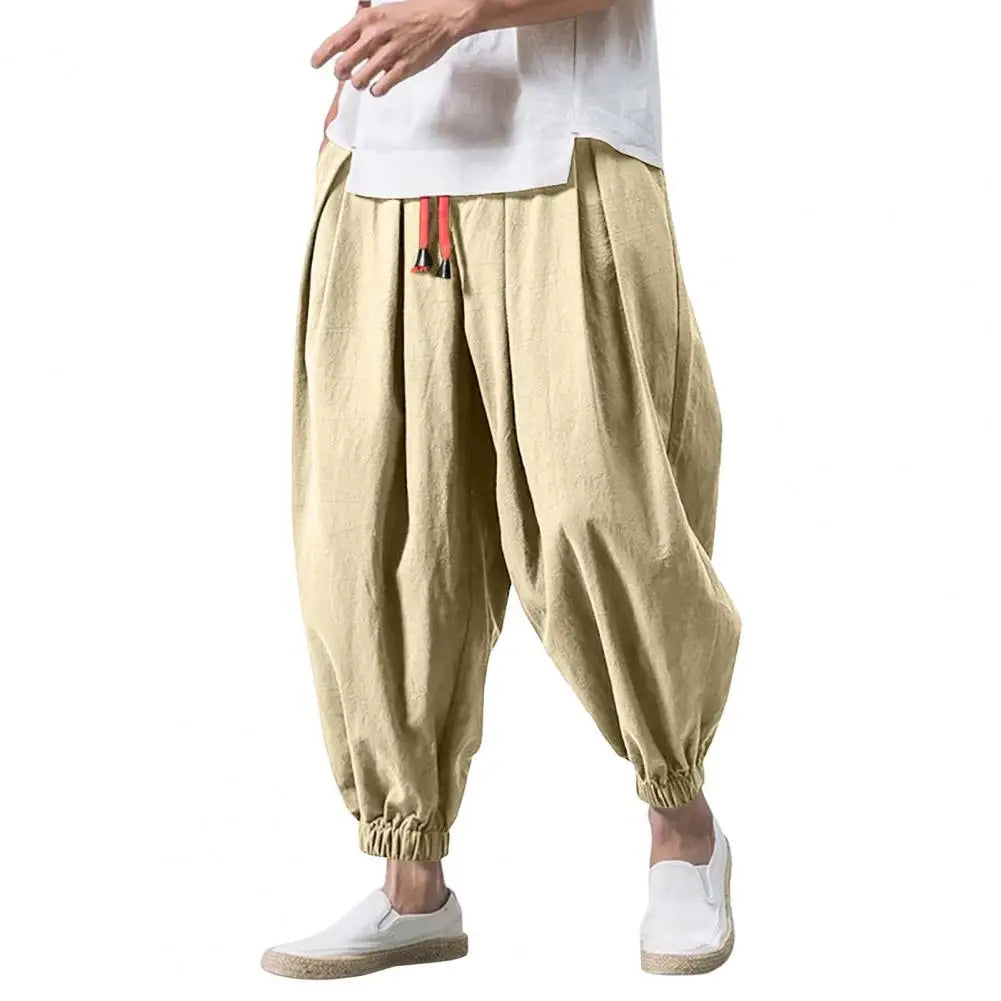 Stay comfortable and stylish in these men's baggy jogging pants featuring a drawstring waist—an ideal choice for a relaxed and casual look! -