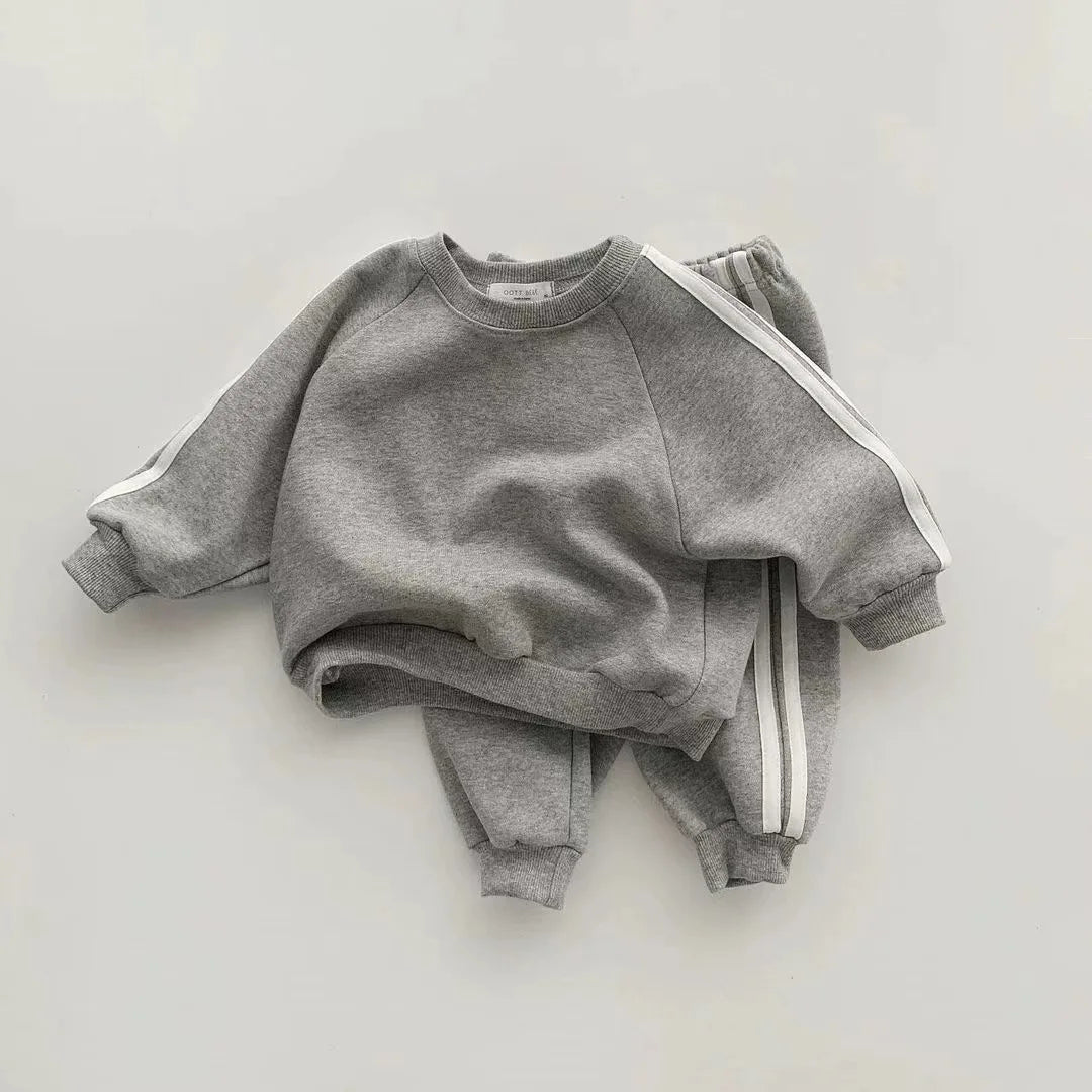 Keep your little one stylish and comfy with this cool two-piece baby suit—featuring a letter-printed zip-up top and matching leisure sports pants! -