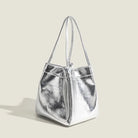 Stay on-trend with this bucket bag—a new fashion staple that offers simplicity, versatility, and a touch of classic style to elevate your wardrobe! -