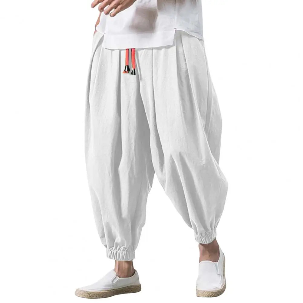 Stay comfortable and stylish in these men's baggy jogging pants featuring a drawstring waist—an ideal choice for a relaxed and casual look! -