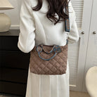 Elevate your style with these luxury designer shoulder crossbody bags for women. Featuring a quilted padded design from a top designer brand, these handbags are perfect for adding a touch of elegance to any outfit. -