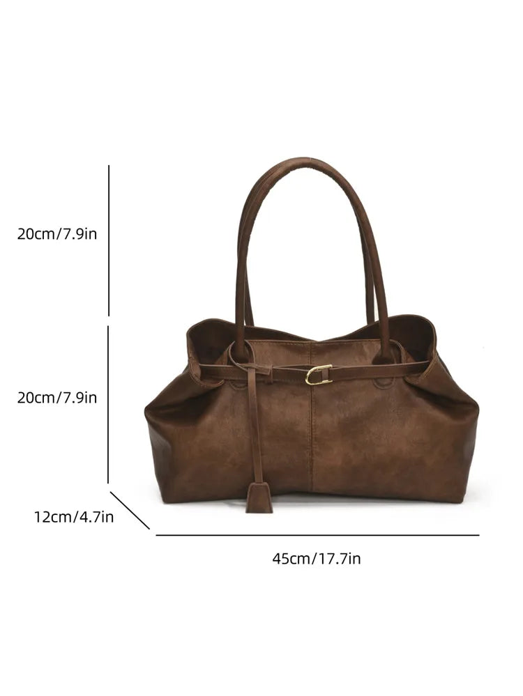 Carry your essentials in style with this women's tote bag. Featuring a large capacity, soft leather construction, and retro casual design, this versatile handbag is perfect for daily use and adds a touch of sophistication to your outfit. -