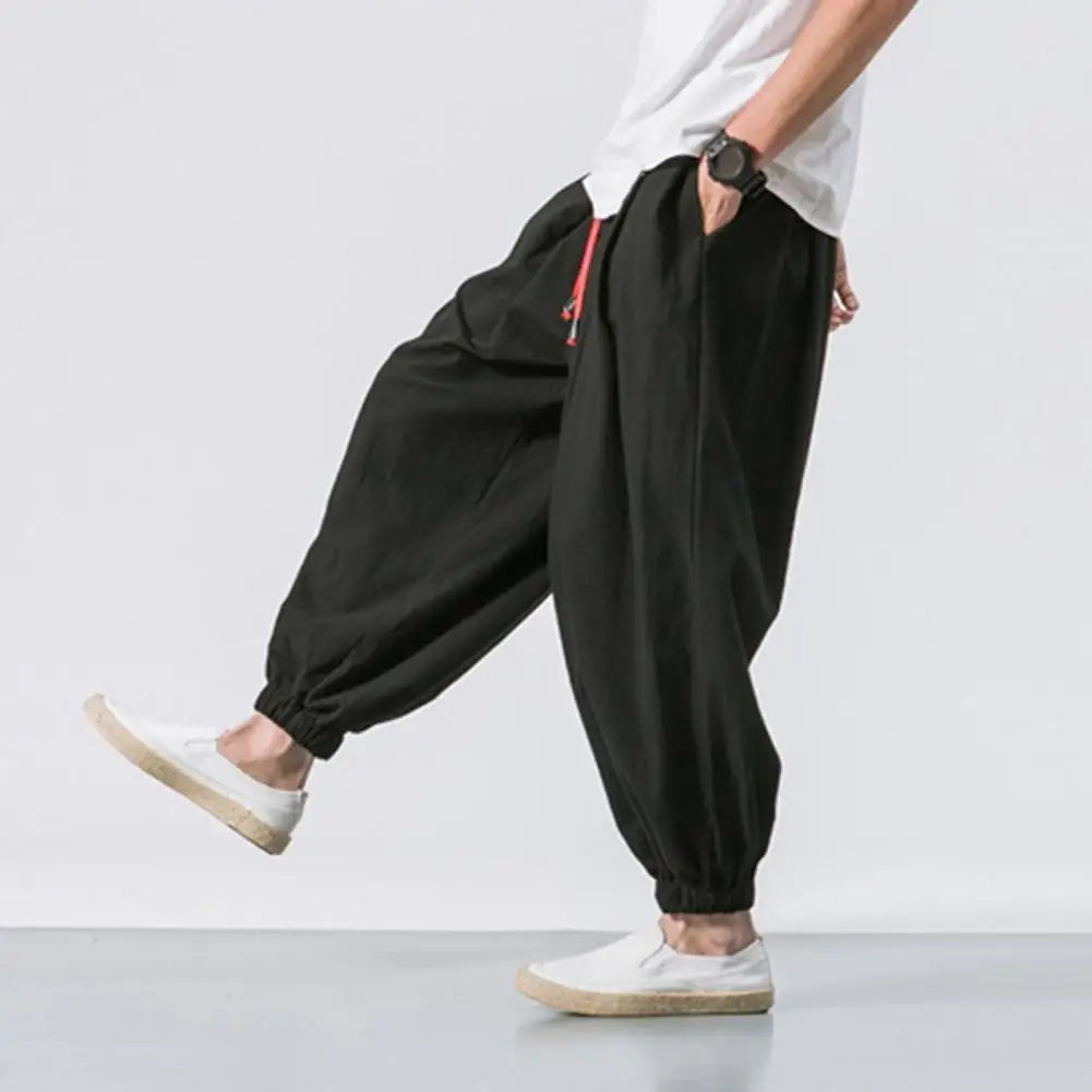 Stay comfortable and stylish in these men's baggy jogging pants featuring a drawstring waist—an ideal choice for a relaxed and casual look! -