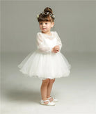 Make your baby girl shine in this elegant long-sleeve white party dress—perfect for special occasions! -