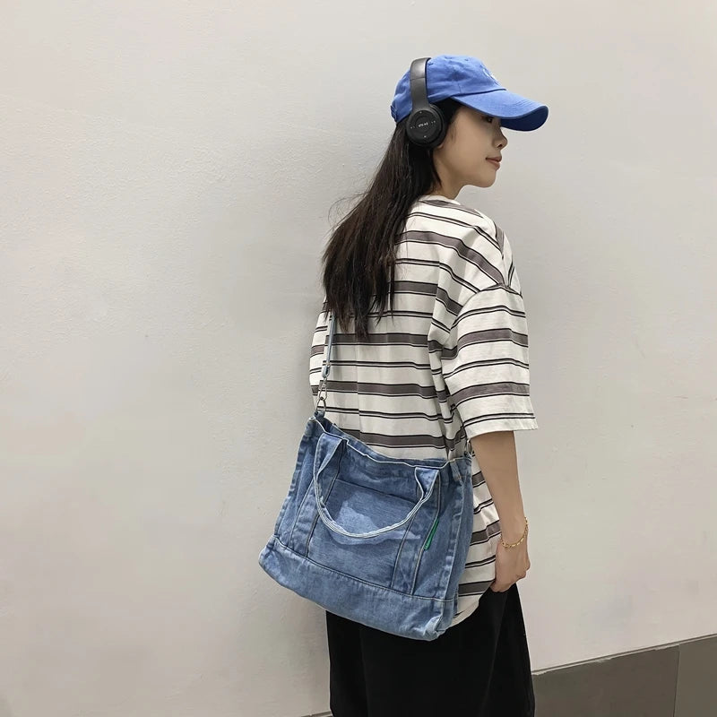 Elevate your casual look with this denim shoulder bag for women. Featuring a large design and zipper closure, this bag is perfect for shopping and everyday use, adding a touch of style to your outfit. -